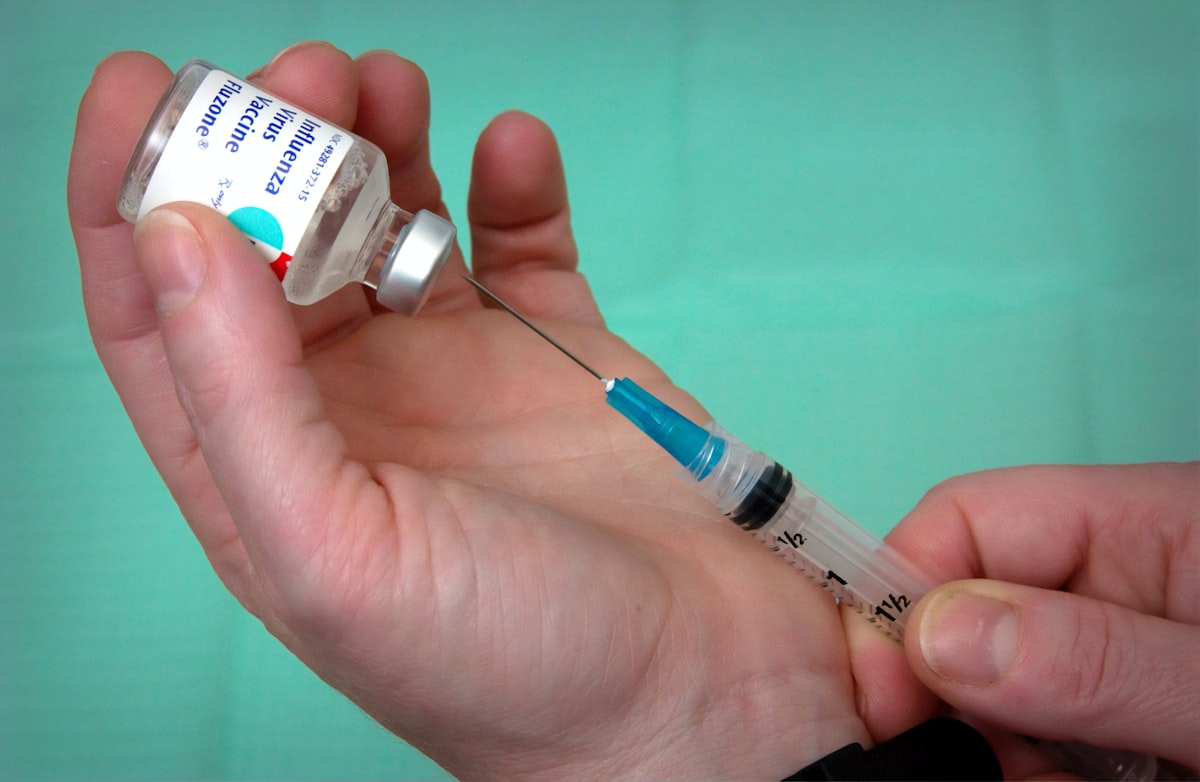 Influenza vaccine vial and syringe